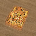 Fresh Baked Pastry Rolls with Patterned Crust in Wicker Basket on Wooden Tabletop