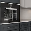 Black Oven As Modern Kitchen Appliance In Contemporary Kitchen With Gray Cabinets White Countertop