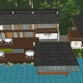 Boutique Guesthouse Building with Wooden Terrace White Tables Chairs Palm Trees Waterfront View