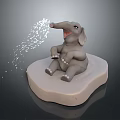 Gray Baby Elephant Sculpture Sitting On Light Base With Trunk Spraying Water Droplets