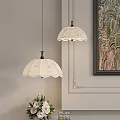 Elegant White Patterned Pendant Lights With Dark Base In Room With Decorative Art And Vase