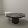 Black Round Coffee Table With White Vase Like Object In Minimalist Setting 3d model