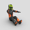 Man In Black And Orange Gear With Green Helmet In Riding Stance
