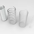 Various Metal Coiled Springs Arranged With Different Spiral Designs and Sizes