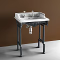Vintage Washbasin With Double Silver Faucets And Carved Black Stand Against Textured Wall