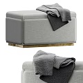 Modern Gray Fabric Ottoman with Gold Base and Gray Blanket on Top