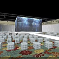 Modern Event Venue With Large LED Stage And White Cube Seats Under Blue Lighting