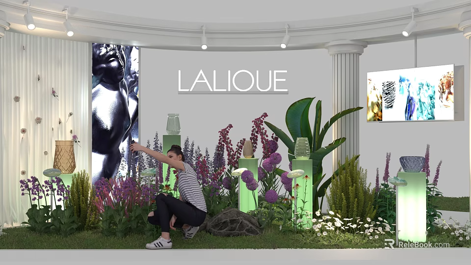 LALIQUE Exhibition Showcase With Colorful Flowers Green Plants And Person Pointing 3d model 