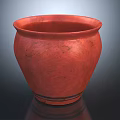 Red Ceramic Vase with Textured Surface and Round Mouth on Dark Background