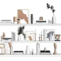 Modern Decorative Ornament Combination With Books Vases Sculptures Framed Art And Plants On White Shelves