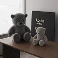 Large Gray And Small Light Gray Teddy Bears On Wooden Table With MacBook Box