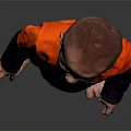 Man In Orange Jumpsuit With Blue Belt And Logo Standing Barefoot On Black Background