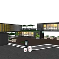 Modern Container Building Café With Black Exterior Large Windows Green Roof And Outdoor Seating