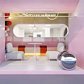 Modern Dessert Shop With Pink Yellow Interiors Curved Walls Round Windows And Orange Seats