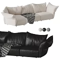 Cream Fabric And Black Leather Sectional Sofa With Striped Blanket Pillows And Decorative Balls