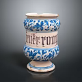 Ceramic Sculpture Vessel Featuring Carved Floral Patterns And Blue White Design