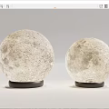 Two Round Table Lamps With Lunar Surface Texture And Modern Black Bases 3d model