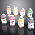 Colorful Bottled Food Drinks With White Labels And Varied Hues On Black Surface