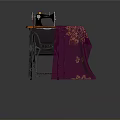 Sewing Machine On Orange Table With Purple Patterned Fabric And Gray Chair