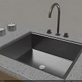 Modern Black Kitchen Sink On Speckled Countertop With Black Faucet And Silver Candles