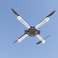 Quadcopter Drone Frame With Four Propellers Flying Against Clear Blue Sky