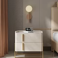 Modern Cream Colored Bedside Table With Drawers Gold Handles And Alarm Clock In Bedroom