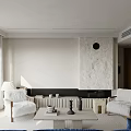 Modern Living Room With White Armchairs Light Coffee Table Textured Fireplace And Black Circular Decor