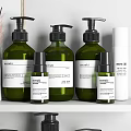 Modern Bathroom Accessories On Shelf With Green Bottles White Containers Toothbrush And Aromatherapy