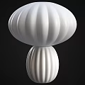 White and Beige Mushroom Shaped Table Lamps with Striped Design on Black Background