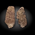 Two Ancient Artifacts With Rough Textured Surface Displayed On Dark Background