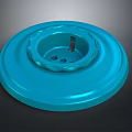 Blue Circular Object With Grooves And Holes On Dark Background