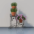 Decorative Black Iron Plant Stand With Terracotta Potted Green Herbs And Purple Flowers