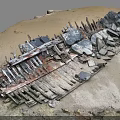 Abandoned Rusted Metal Construction Components With Scattered Stones And Sandy Soil