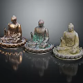 Three Ornate Seated Buddha Statues With Different Color Tones On Lotus Bases