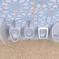 Various Modern Urinals Mounted on Blue Patterned Tile Wall in Bathroom
