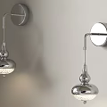 Modern Chrome Wall Lamps With Sleek Design And Round Glass Shades On Light Colored Wall