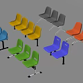 Multicolored Outdoor Chairs with Plastic Seats and Metal Frames in Row