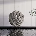 Gray Spiral Sculpture on Water Platform with White Wall Background and Small Tree Nearby
