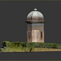 Red Brick Tower With Dome Roof And Circular Hedge On Stone Platform