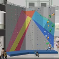 Colorful Indoor Climbing Wall In Shopping Mall With Climbing Holds And People