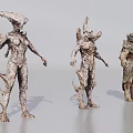 Three Man Shaped Alien Figures With Armored Bodies And Horned Heads