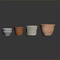 Set of Four Colorful Decorative Flower Pots with Textured Surfaces and Assorted Colors