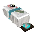 Comfortable Massage Bed With White Sheet Blue Ribbon Black Tray And Pink Petals