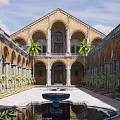 Historic Arched Courtyard Garden With Central Fountain Palm Trees And Reflecting Pool
