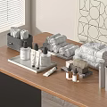 Daily Washing Essentials Display On Wooden Table With Towels Care Bottles Toothpaste And Toothbrush Holder