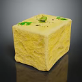 Yellow Cube Shaped Food With Green Herbs And Olive Topping On Textured Surface