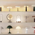 Various Stylish Table Lamps With Modern Design Displayed On Shelves For Home Decor