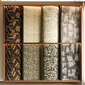 Various Colorful Patterned Fabric Samples Arranged On Display Shelf