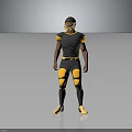 Football Player In Black And Yellow Uniform With Helmet Knee Pads Standing Against Gray Background