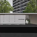 Modern Entrance Gate With Covered Structure And Green Plants Near High Rise Building